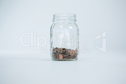 Coins in glass jar