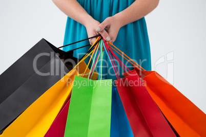 Woman carrying colorful shopping bags