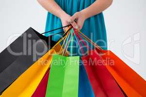 Woman carrying colorful shopping bags