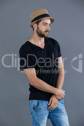 Man in black t-shirt and fedora hat