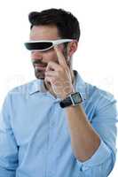 Man wearing virtual reality glasses and smart watch