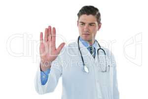 Male doctor touching an digital screen