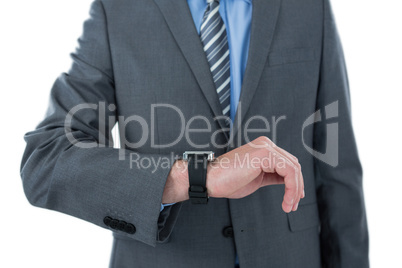 Businessman checking time on his watch