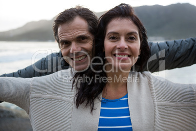 Portrait of romantic couple enjoying on beach