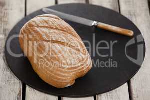 Bread loaf on cutting board