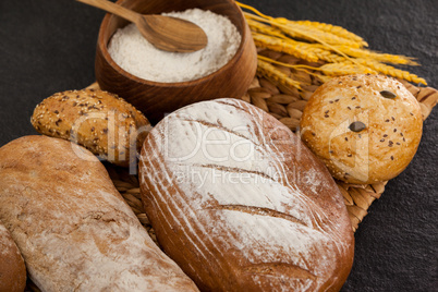 Various bread loaves with flour