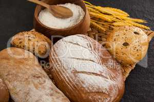 Various bread loaves with flour
