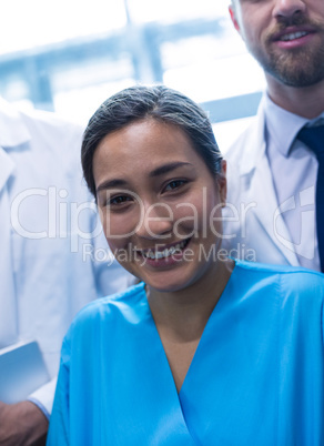 Smiling nurse standing in hospital