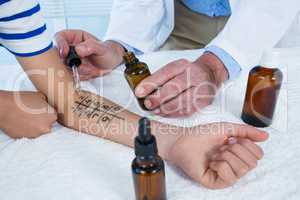 Doctor performing allergy test on skin