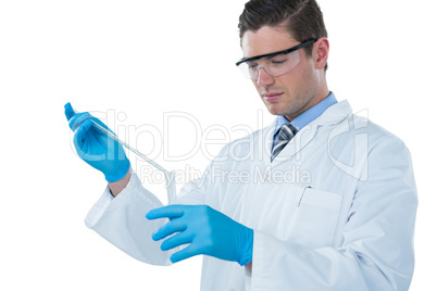 Doctor wearing medical gloves filling the test tube