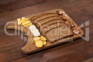 Slices of brown bread and variety of cheese