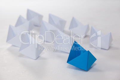 Paper boats arranged together
