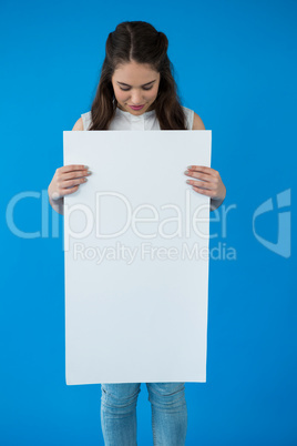 Woman holding a blank placard