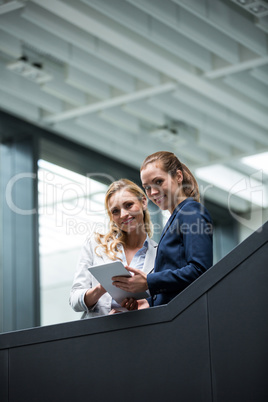 Businesswomen using digital tablet