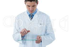 Male doctor using an futuristic digital tablet