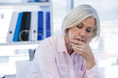 Upset patient sitting at medical clinic