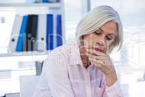 Upset patient sitting at medical clinic