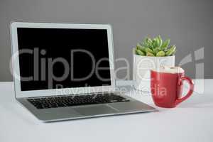 Laptop with cup of coffee