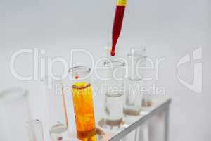 Blood sample being drop into test tubes