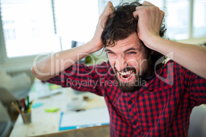 Frustrated business executive at desk