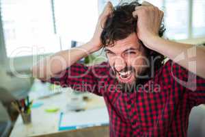 Frustrated business executive at desk