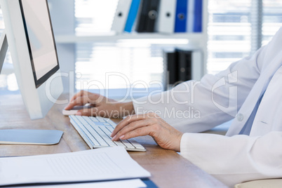 Female doctor working on computer