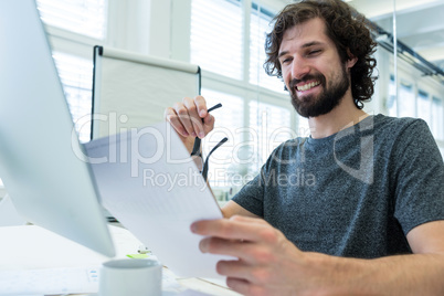 Graphic designer working at his desk