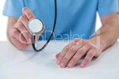 Surgeon holding a stethoscope