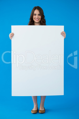 Woman holding a blank placard