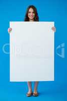 Woman holding a blank placard