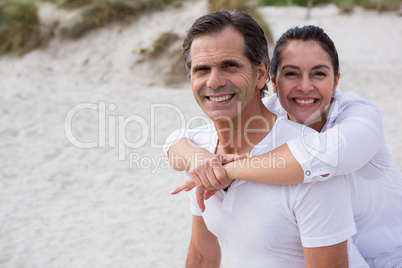 Portrait of romantic couple enjoying on beach