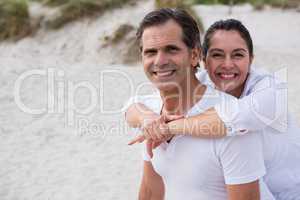 Portrait of romantic couple enjoying on beach