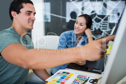 Graphic designers working at desk