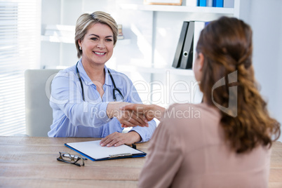 Doctor shaking hands with patient