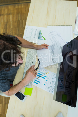 Graphic designer working at his desk