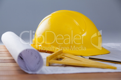 Architectural plan with tools and hard hat