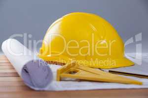 Architectural plan with tools and hard hat