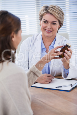 Female doctor explaining medicine to patient