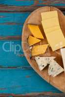 Variety of cheese on heart shaped chopping board