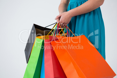 Woman carrying colorful shopping bags