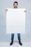 Man holding a blank placard