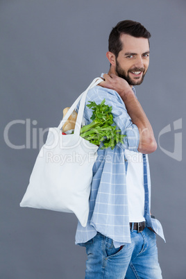 Man carrying a grocery bag