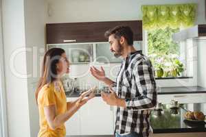 Couple having argument in kitchen
