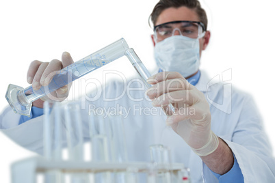 Doctor wearing medical gloves filling the test tube