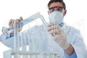 Doctor wearing medical gloves filling the test tube