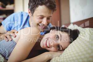 Romantic couple relaxing on bed