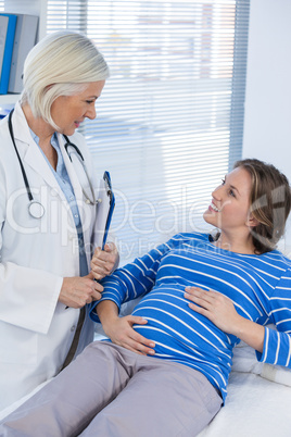 Pregnant patient consulting a doctor