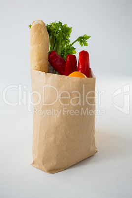 Fruits and vegetables in brown grocery bag