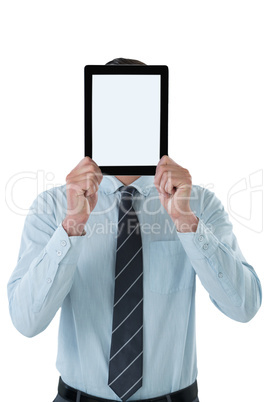 Businessman holding digital tablet in front of his face