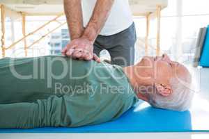 Paramedic performing resuscitation on patient